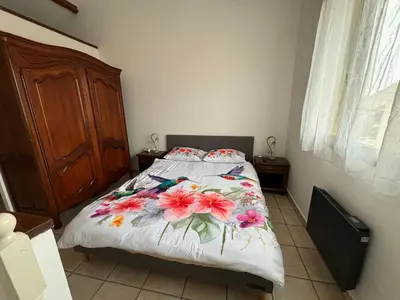 Un ou plusieurs lits dans un hébergement de l'établissement Maison 3 appartements