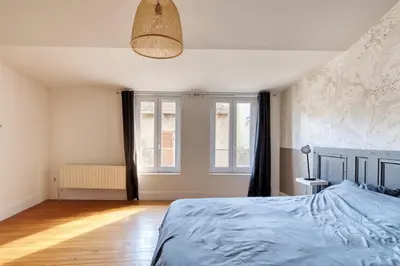 Un ou plusieurs lits dans un hébergement de l'établissement La Bonne Adresse - T2 - Montluel