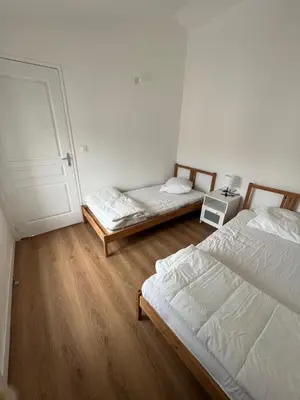 Un ou plusieurs lits dans un hébergement de l'établissement Signature Apartment