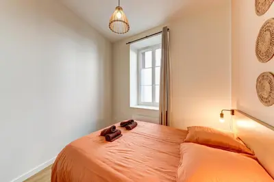 Un ou plusieurs lits dans un hébergement de l'établissement L'Opaline - Appartement premium à deux pas de Lyon
