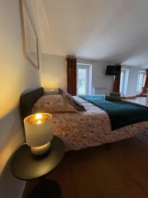 Un ou plusieurs lits dans un hébergement de l'établissement Studio Provençal au centre-ville de Vienne