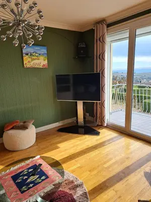 Télévision ou salle de divertissement dans l'établissement Maison du Tari