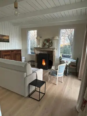 Coin salon dans l'établissement Le Cottage