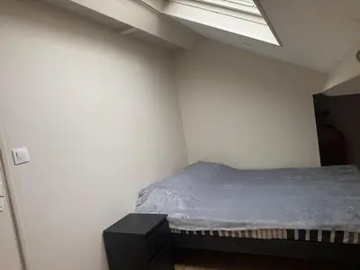 Un ou plusieurs lits dans un hébergement de l'établissement T2 Apartment