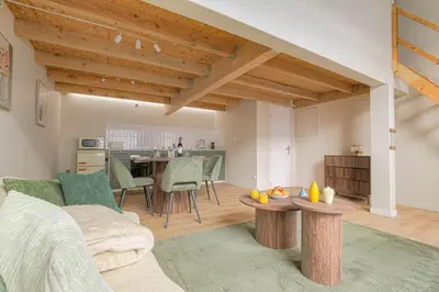 Cuisine ou kitchenette dans l'établissement Le Loft des Lumières Spa Privatif & Nuit Cinéma