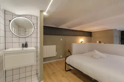 Un ou plusieurs lits dans un hébergement de l'établissement Loft Industriel & Vintage