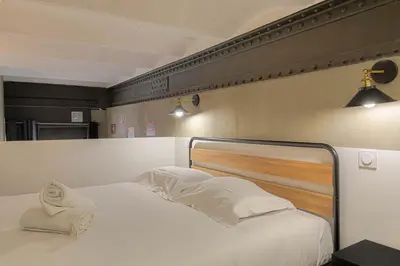 Un ou plusieurs lits dans un hébergement de l'établissement Loft Industriel & Vintage