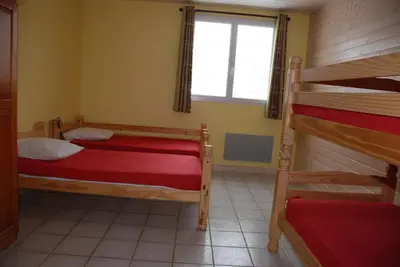 Un ou plusieurs lits dans un hébergement de l'établissement Domaine des Gardette