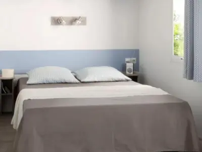 Un ou plusieurs lits dans un hébergement de l'établissement Mobil home spacieux 6 pers avec terrasse - API-1-52-1417