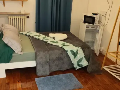 Un ou plusieurs lits dans un hébergement de l'établissement Chambre Cosy calme et appaisante