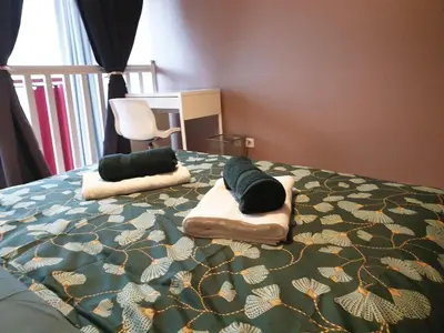 Un ou plusieurs lits dans un hébergement de l'établissement L Esprit Loft, Duplex pour 4 proche Lyon et PartDieu
