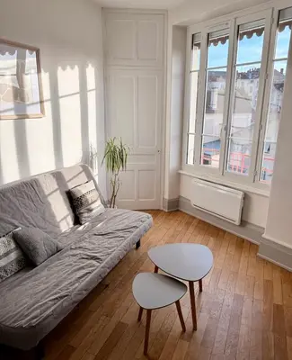 Coin salon dans l'établissement Le Vert Luizet - Lumineux, Wifi, TV connectée