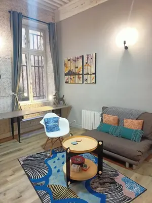 Coin salon dans l'établissement Appartement