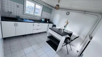 Cuisine ou kitchenette dans l'établissement Logement - maison d'hôtes Communay