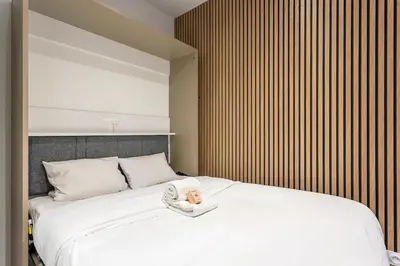 Un ou plusieurs lits dans un hébergement de l'établissement Exceptional Apartment - Terrace 2P Oullins