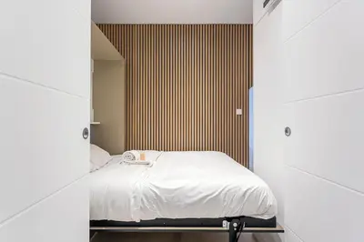 Un ou plusieurs lits dans un hébergement de l'établissement Exceptional Apartment - Terrace 2P Oullins