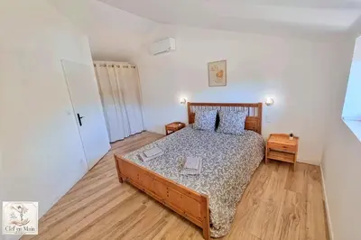 Un ou plusieurs lits dans un hébergement de l'établissement Parenthèse en Dombes Maison au calme avec jardin