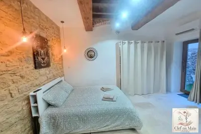 Un ou plusieurs lits dans un hébergement de l'établissement Le Petit Cocon Cozy studio proche de Lyon