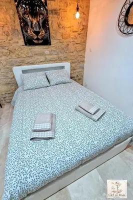 Un ou plusieurs lits dans un hébergement de l'établissement Le Petit Cocon Cozy studio proche de Lyon