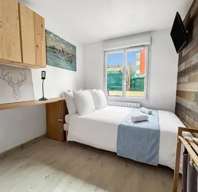 Un ou plusieurs lits dans un hébergement de l'établissement Appartement Avec Grande Terrasse Proche du Centre