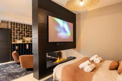 Un ou plusieurs lits dans un hébergement de l'établissement Host Inn Velvy Suite
