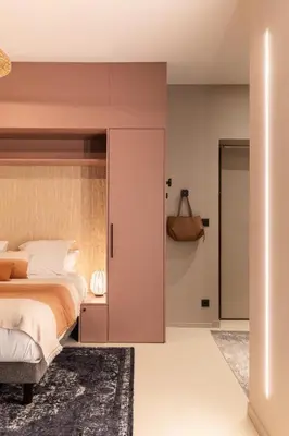 Un ou plusieurs lits dans un hébergement de l'établissement Host Inn Velvy Suite