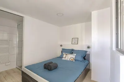 Un ou plusieurs lits dans un hébergement de l'établissement Appartement l'Atelier Les écrins de corbas