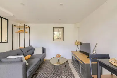 Coin salon dans l'établissement Appartement l'Atelier Les écrins de corbas
