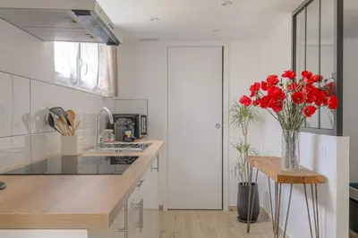 Cuisine ou kitchenette dans l'établissement Appartement l'Atelier Les écrins de corbas