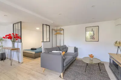 Coin salon dans l'établissement Appartement l'Atelier Les écrins de corbas