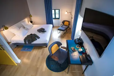 Un ou plusieurs lits dans un hébergement de l'établissement Fourvière Hôtel