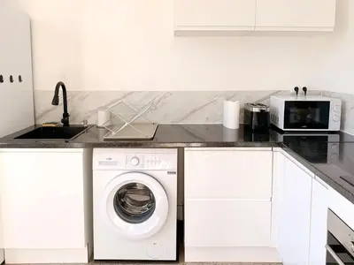 Cuisine ou kitchenette dans l'établissement Le 188 · Wifi, Lumineux, Cosy