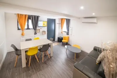 Coin salon dans l'établissement Appartement Sun GroupamaLyon Eurexpo