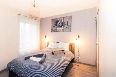 Un ou plusieurs lits dans un hébergement de l'établissement Chic Stopover L'Olivier City Center & Flavors