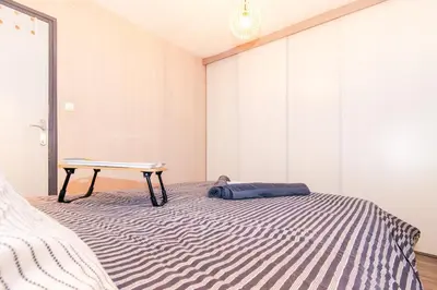 Un ou plusieurs lits dans un hébergement de l'établissement Chic Stopover L'Olivier City Center & Flavors