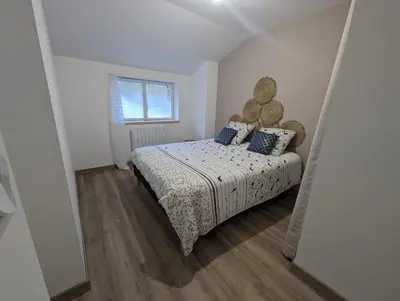 Un ou plusieurs lits dans un hébergement de l'établissement Logement au cœur d'une ferme