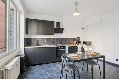 Cuisine ou kitchenette dans l'établissement Superbe Appartement T3 - Cosy & Spacieux - Lyon 6e, Brotteaux