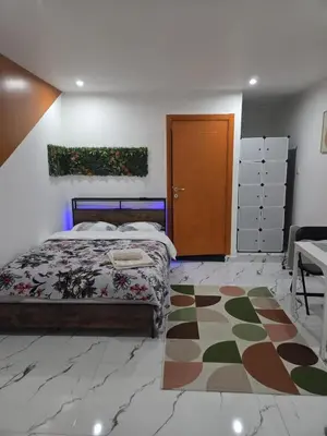Un ou plusieurs lits dans un hébergement de l'établissement Cozy renovated studio Comfort practicality