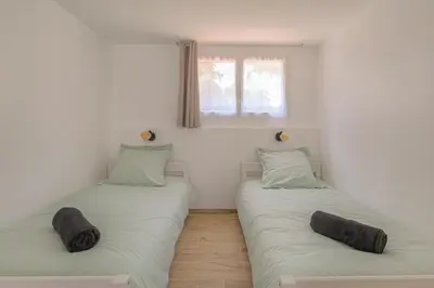 Un ou plusieurs lits dans un hébergement de l'établissement Apartment L'éclat Les Écrins de Corbas