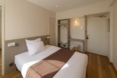 Un ou plusieurs lits dans un hébergement de l'établissement La Sorelle Hôtel Golf et Restaurant