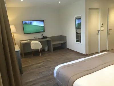 Un ou plusieurs lits dans un hébergement de l'établissement La Sorelle Hôtel Golf et Restaurant
