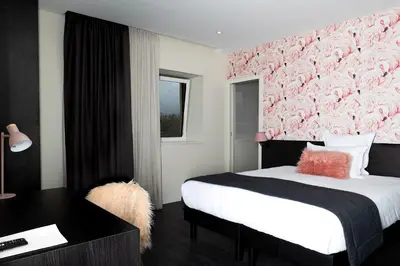 Un ou plusieurs lits dans un hébergement de l'établissement La Sorelle Hôtel Golf et Restaurant