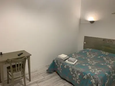 Un ou plusieurs lits dans un hébergement de l'établissement hôtel Le Cosy