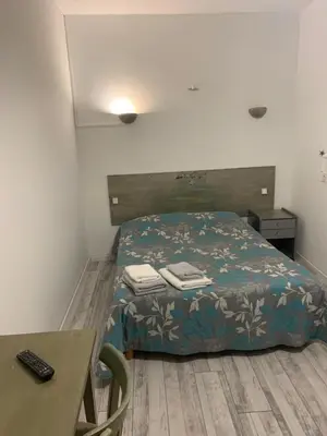 Un ou plusieurs lits dans un hébergement de l'établissement hôtel Le Cosy