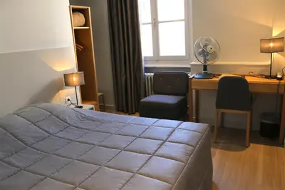 Un ou plusieurs lits dans un hébergement de l'établissement Hotel du Théatre