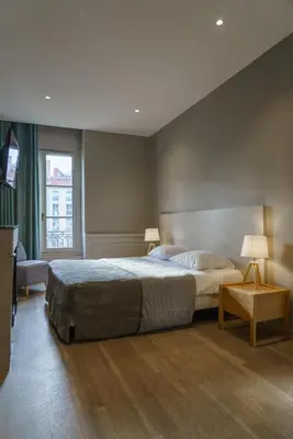 Un ou plusieurs lits dans un hébergement de l'établissement Hotel du Théatre