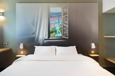 Un ou plusieurs lits dans un hébergement de l'établissement B&B HOTEL Lyon St Priest