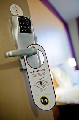 Un ou plusieurs lits dans un hébergement de l'établissement B&B HOTEL Lyon St Priest