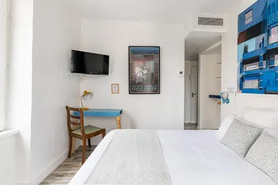 Un ou plusieurs lits dans un hébergement de l'établissement Hôtel du Simplon