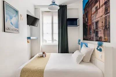 Un ou plusieurs lits dans un hébergement de l'établissement Hôtel du Simplon